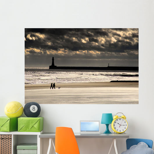 Scenic View Of Sandy Beach With Lighthouse And Groyne Wall Mural