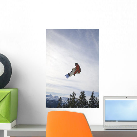 Man Snowboarding, Jumping In Mid-Air Wall Mural