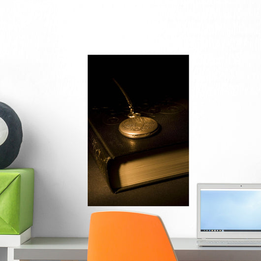 Gold Pocket Watch Resting On A Book Wall Mural
