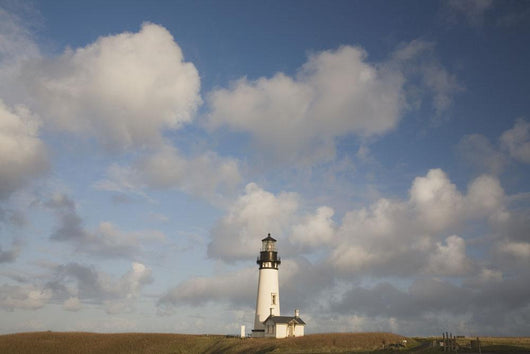 Lighthouse With Cloudy Backdrop Wall Mural
