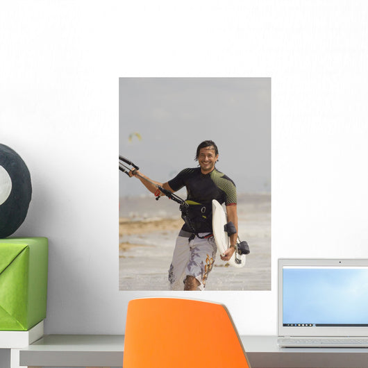 Man Carrying Kitesurfing Board Wall Mural