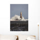 Waves Crashing Against A Lighthouse Wall Mural