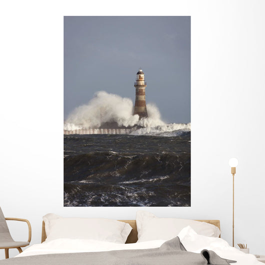 Waves Crashing Against A Lighthouse Wall Mural