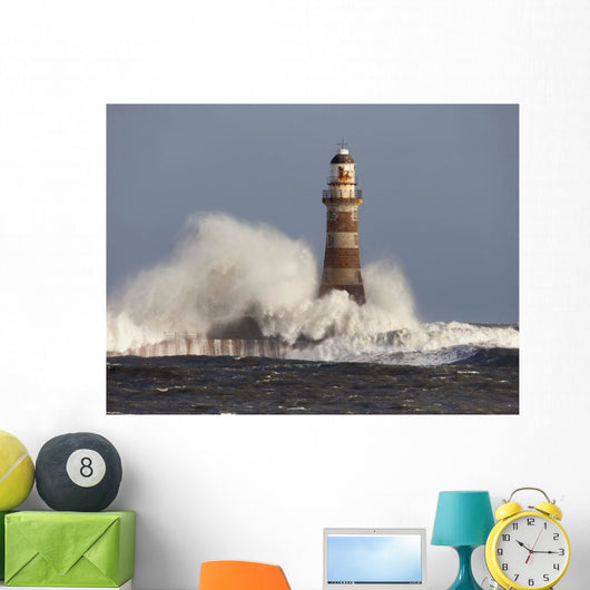 Waves Crashing Against A Lighthouse Wall Mural