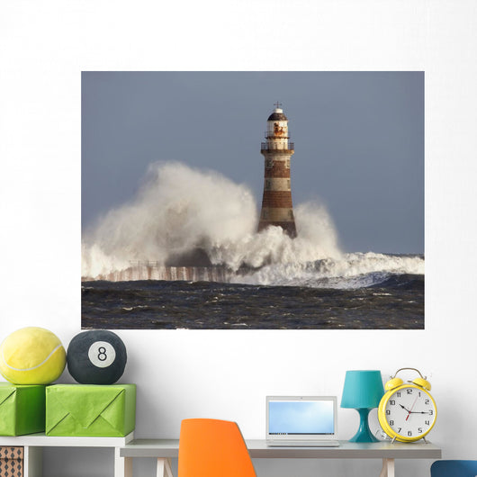 Waves Crashing Against A Lighthouse Wall Mural