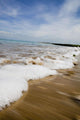 Sea Washing In Onto Sandy Beach Wall Mural