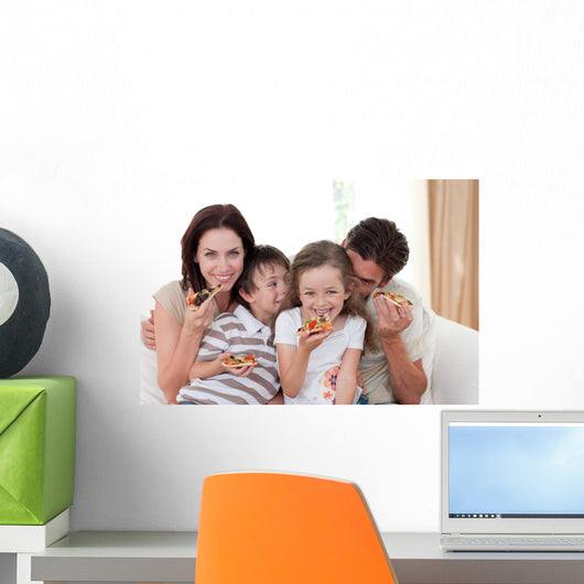Happy family eating pizza Wall Mural