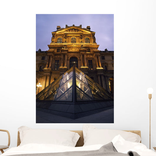 Small Glass Pyramid Outside The Louvre Museum At Dusk Wall Mural