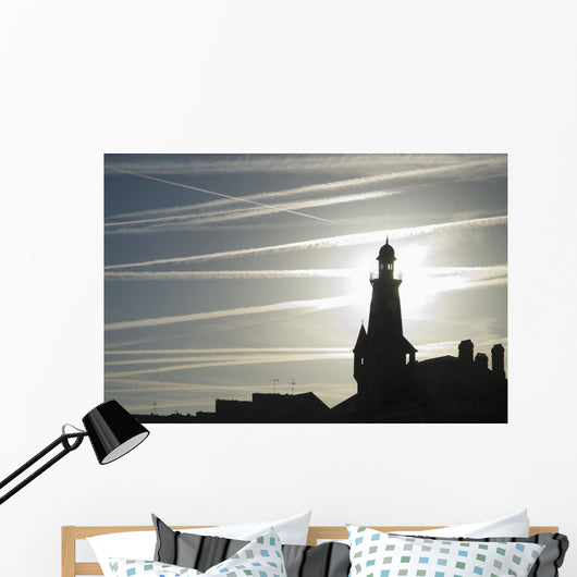Airplane Contrails Above Lighthouse Wall Mural