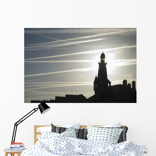 Airplane Contrails Above Lighthouse Wall Mural