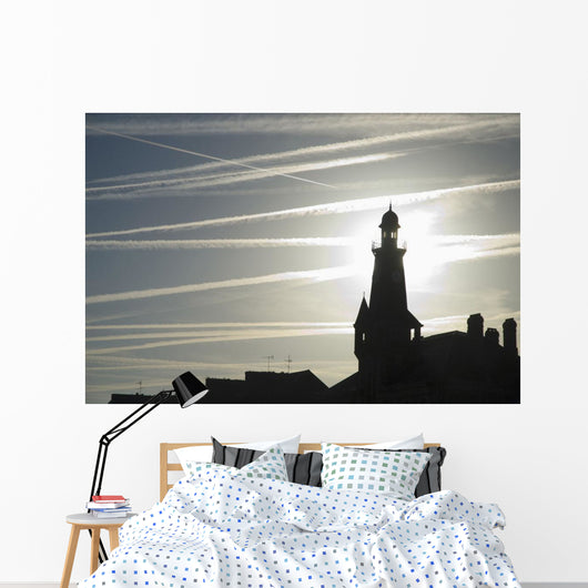 Airplane Contrails Above Lighthouse Wall Mural