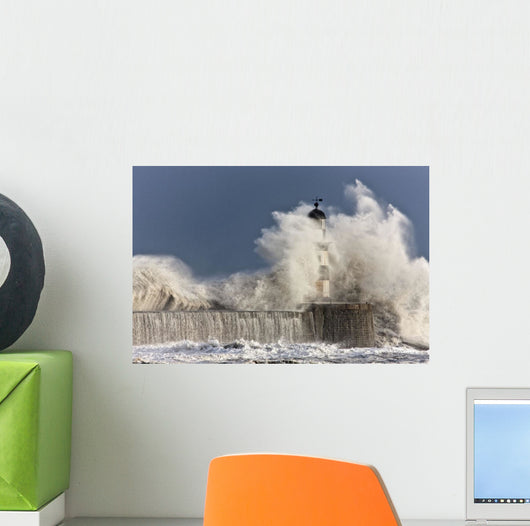 Waves Crashing Up Against A Lighthouse Wall Mural