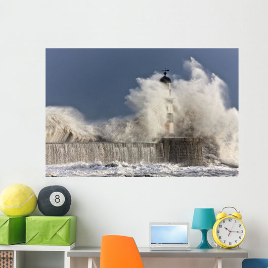 Waves Crashing Up Against A Lighthouse Wall Mural