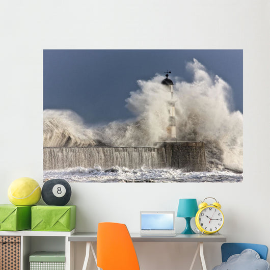 Waves Crashing Up Against A Lighthouse Wall Mural