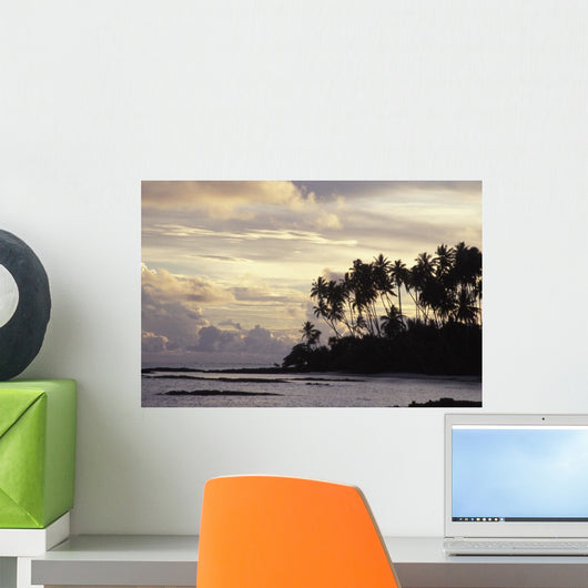 Silhouetted Palm Trees Over Beach At Sunset Wall Mural