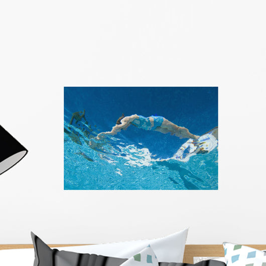 Underwater View Of Woman Diving Into Pool Wall Mural