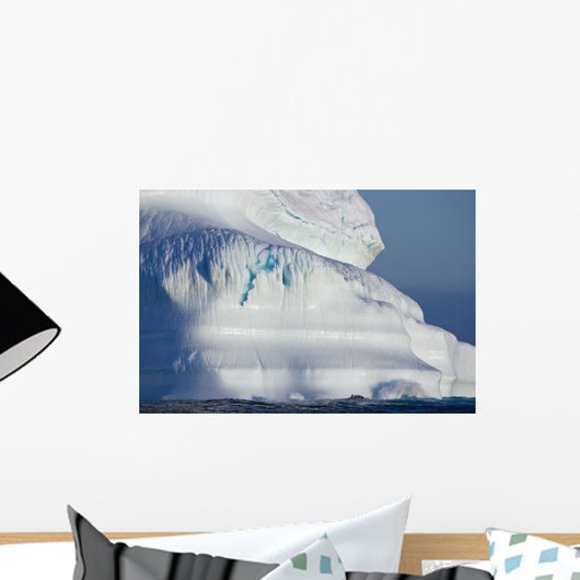 A Composite Image Of Tourists Exploring An Iceberg Wall Mural