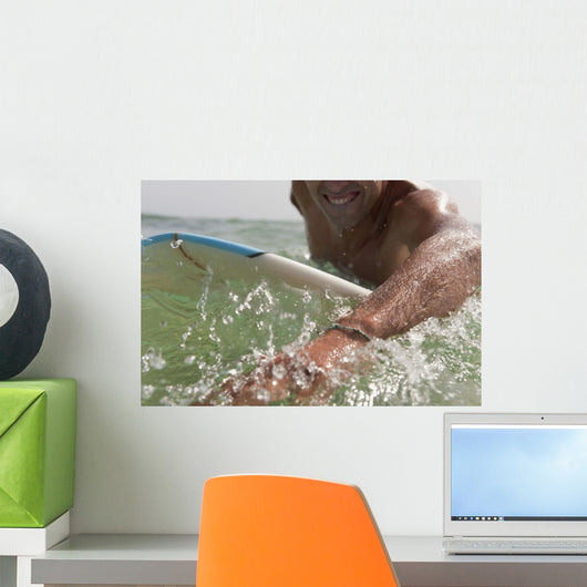 A Man Paddling On His Surfboard Off Valdevequeros Beach Wall Mural