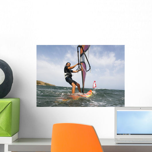 A Man Surfing Off The Coast Of Parque Natural Del Estrecho Wall Mural