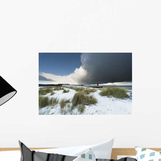 Dark Clouds And Blue Sky Over A Red Lighthouse Along The Coast Wall Mural