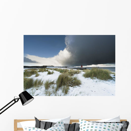 Dark Clouds And Blue Sky Over A Red Lighthouse Along The Coast Wall Mural