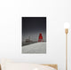 A Red Lighthouse Along The Coast In Winter With A Boat Off The Shore Wall Mural
