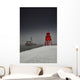A Red Lighthouse Along The Coast In Winter With A Boat Off The Shore Wall Mural