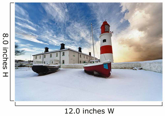 Boats Sitting On A Frozen Surface With A Lighthouse And Building Wall Mural