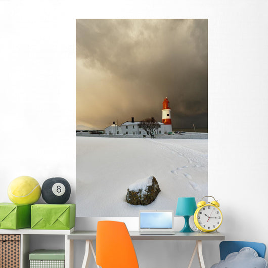 A Lighthouse And Building In Winter Wall Mural