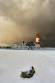 A Lighthouse And Building In Winter Wall Mural