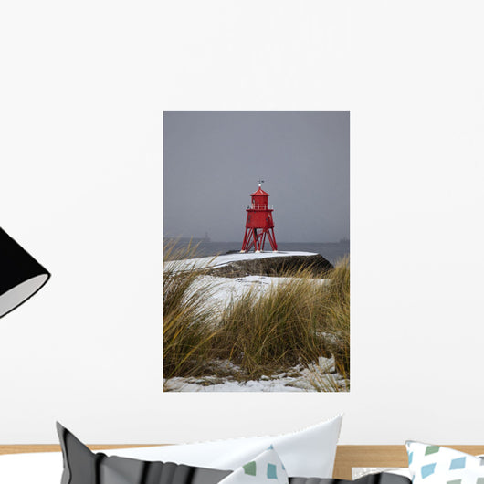 A Red Lighthouse Along The Coast Wall Mural