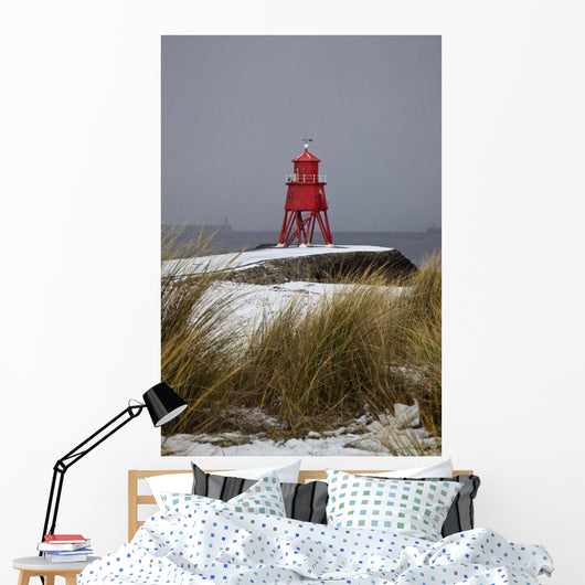 A Red Lighthouse Along The Coast Wall Mural