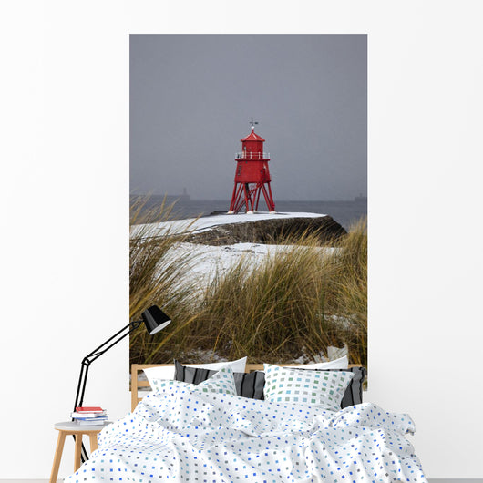A Red Lighthouse Along The Coast Wall Mural