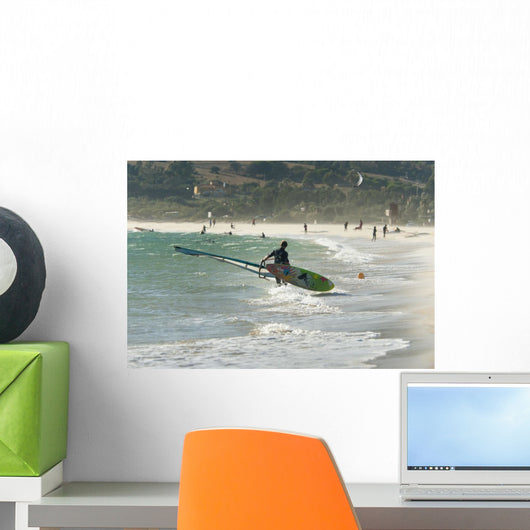 A Man On The Beach With His Windsurfing Board Wall Mural