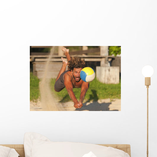 A Man Diving For A Beach Ball Wall Mural
