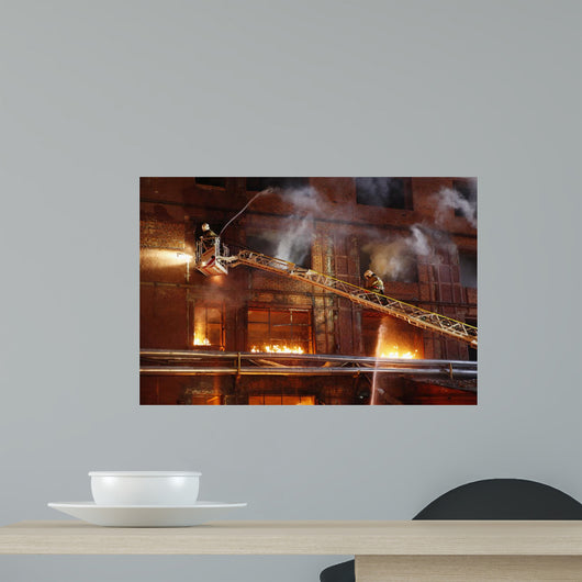 Firefighters fighting a fire Wall Mural