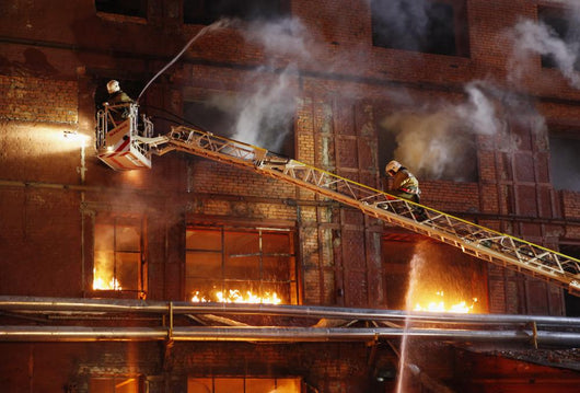 Firefighters fighting a fire Wall Mural