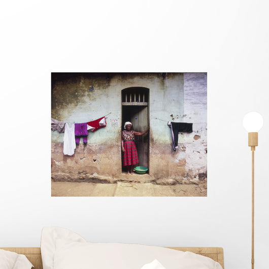 Woman In Front Of The House Wall Mural