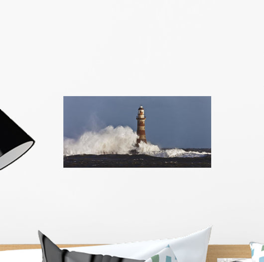 Waves Crashing Against A Lighthouse Wall Mural