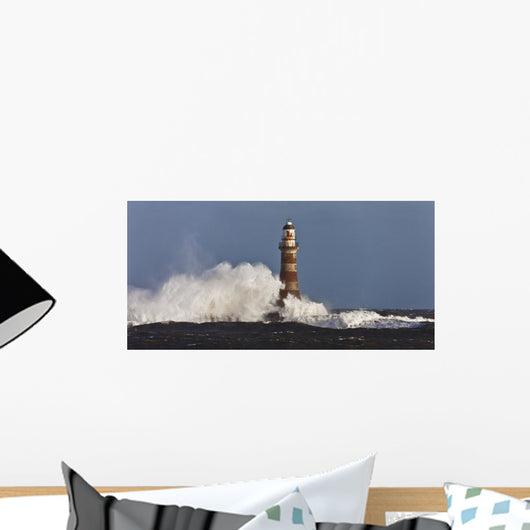 Waves Crashing Against A Lighthouse Wall Mural