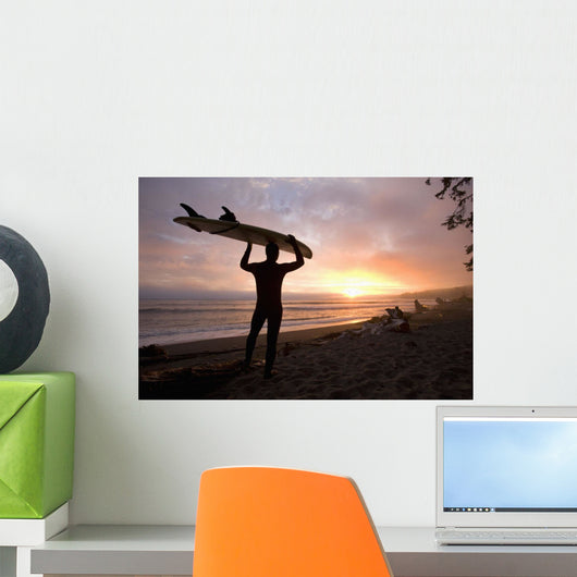 A Man Carrying His Surfboard Wall Mural