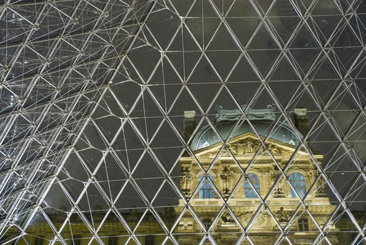 Looking Out Of The Pyramid To The Louvre Museum At Night Wall Mural