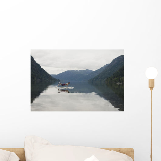 A Young Man Leaps Onto His Body Board In Cameron Lake Wall Mural