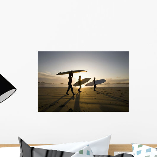 Silhouette Of Three Surfers Carrying Surfboards Wall Mural