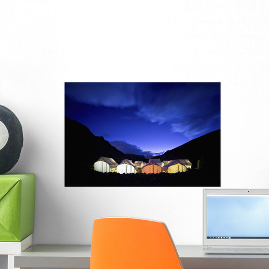 Tents Illuminated In A Valley At Night Wall Mural