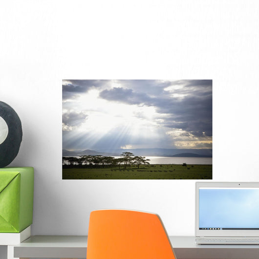 Sunlight Shines Down Through The Clouds Onto A Lake Wall Mural