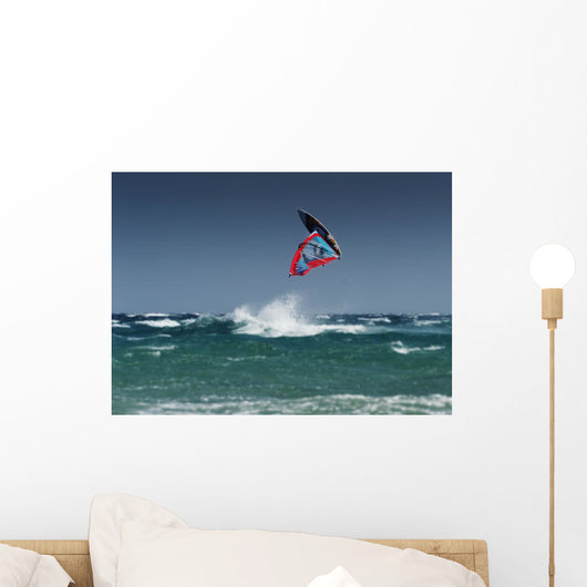 A Windsurfer Flips Upside Down Above The Water Off Punta Paloma Wall Mural