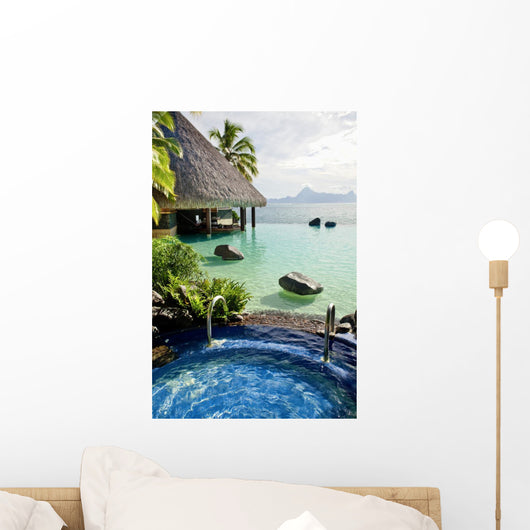 Jacuzzi and infinity pool over tropical ocean Wall Mural