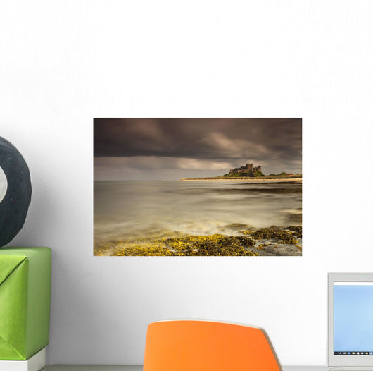 Bamburgh Castle Under A Cloudy Sky Wall Mural