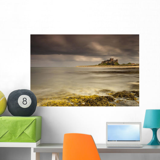 Bamburgh Castle Under A Cloudy Sky Wall Mural